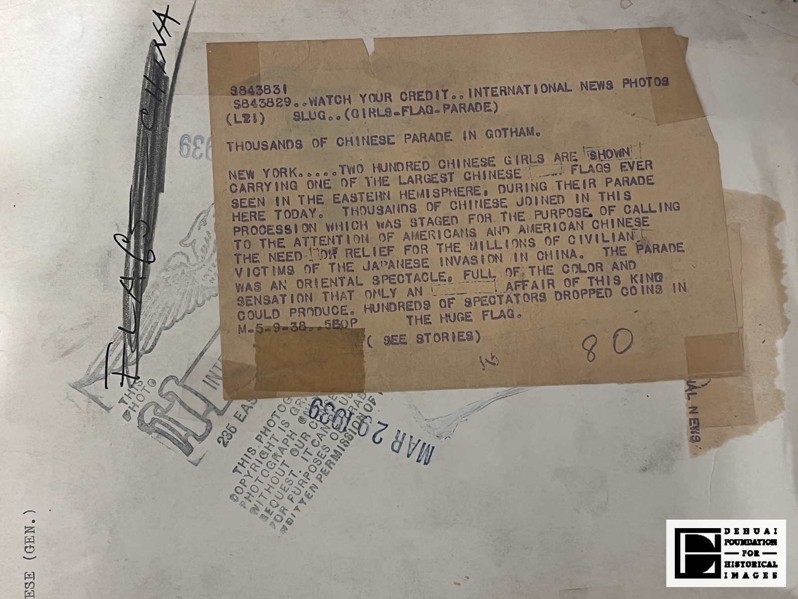 TFA-CA-121 — Verso: the International News Photos caption slip with its ink-boxed corrections, the MAR 20 1939 date stamp, the agency eagle device and copyright stamp, and the hand-lettered file heading FLAGS — CHINA.