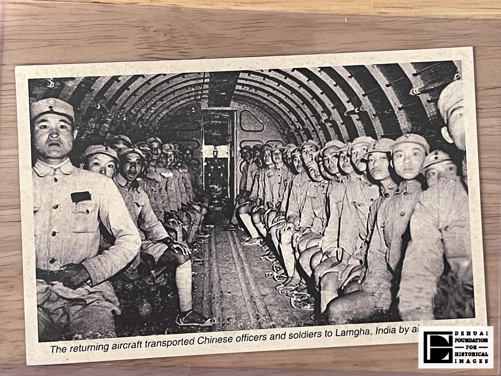 TFA-CA-129 — Face of the card: the photograph of the aircraft cabin and the single printed caption line along the lower edge. The reverse was not photographed.
